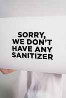 signboard informing unavailability of sanitizers